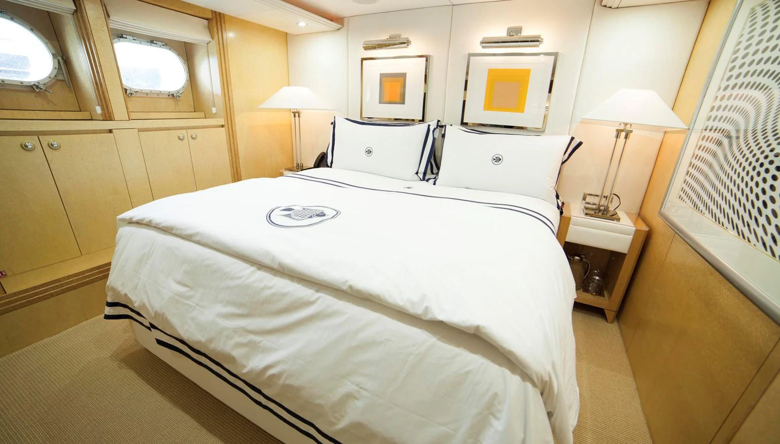 The stateroom features a luxurious bed with elegant linens and modern decor. aboard OCEANA I Yacht for Sale
