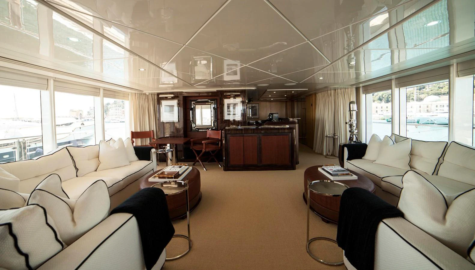 The yacht's salon features luxurious seating with elegant decor and ample natural light. aboard OCEANA I Yacht for Sale