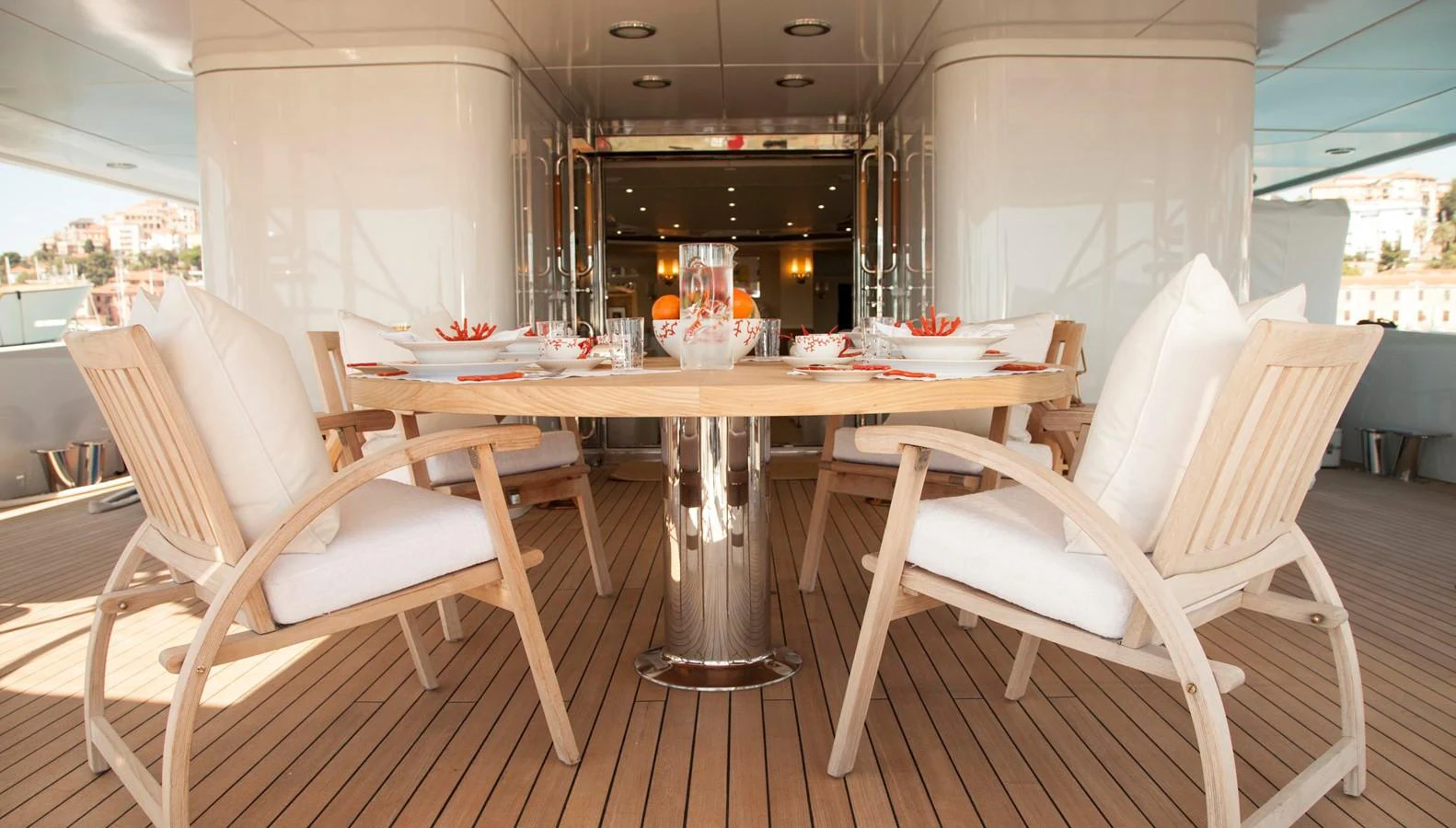 The aft deck features an elegant dining area with a stylish table and comfortable seating. aboard OCEANA I Yacht for Sale