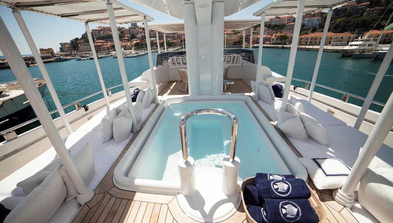 The sundeck features a luxurious jacuzzi surrounded by comfortable seating and stunning views. aboard OCEANA I Yacht for Sale