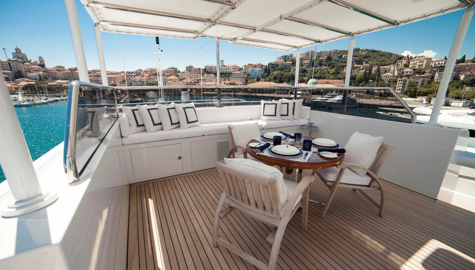 The flybridge offers a spacious and inviting area for alfresco dining with stunning views. aboard OCEANA I Yacht for Sale