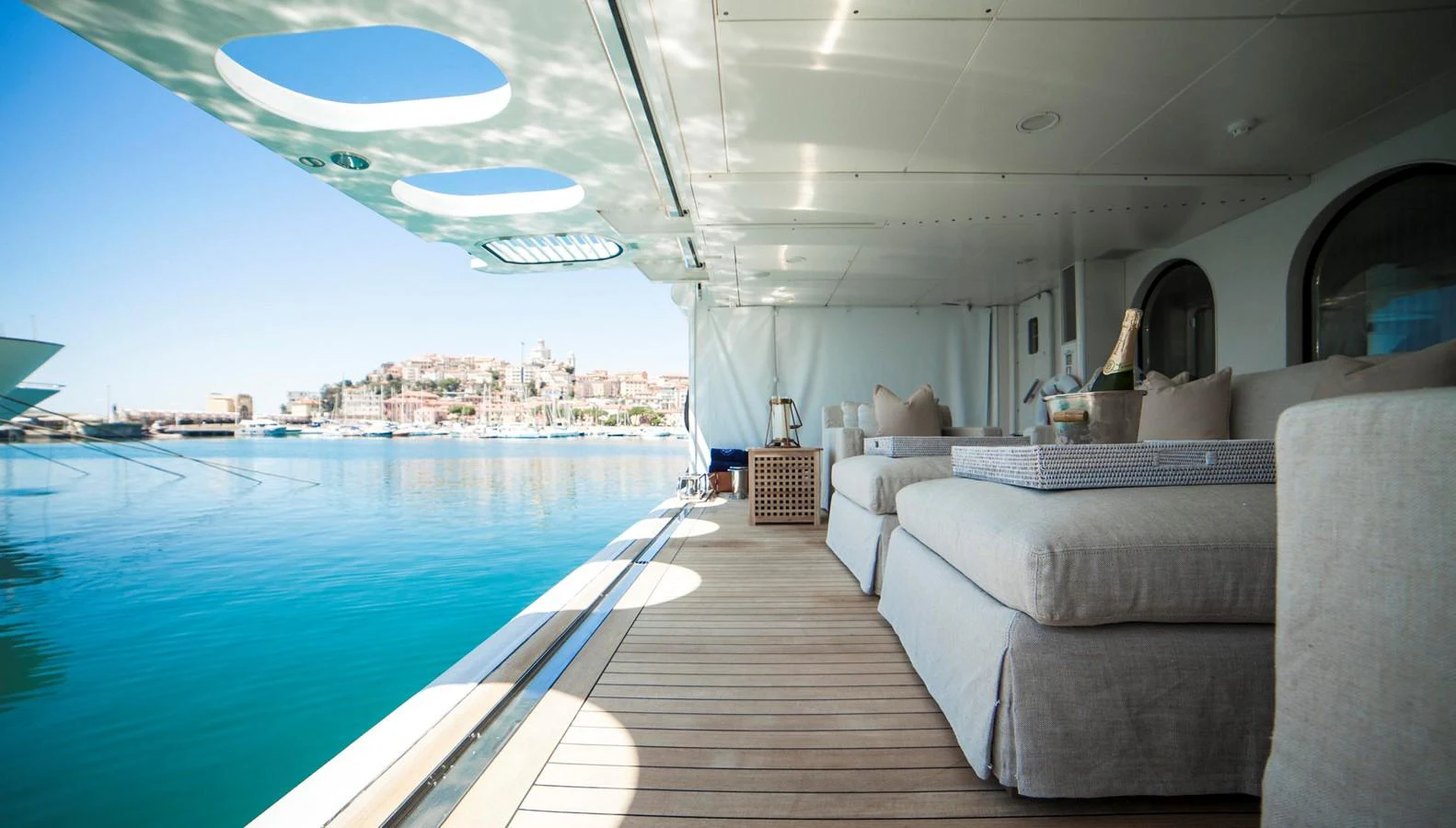 The aft deck offers a luxurious lounging area with comfortable seating and stunning waterfront views. aboard OCEANA I Yacht for Sale
