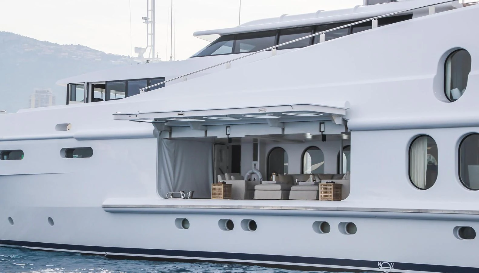 The yacht showcases a sleek exterior with an open lounge area, perfect for relaxation and enjoying the view. aboard OCEANA I Yacht for Sale