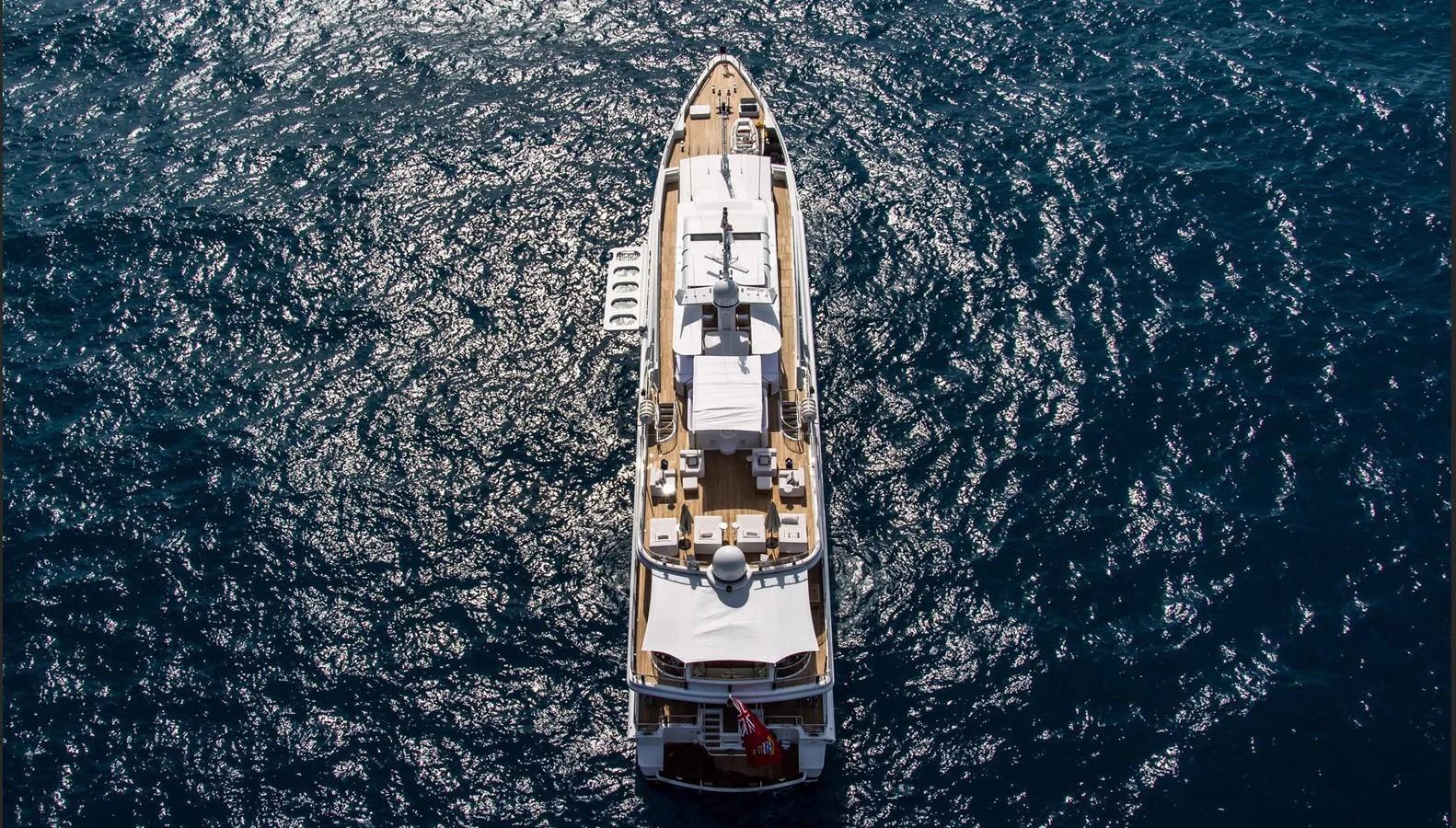 A luxurious yacht cruising on open waters, viewed from above. aboard OCEANA I Yacht for Sale