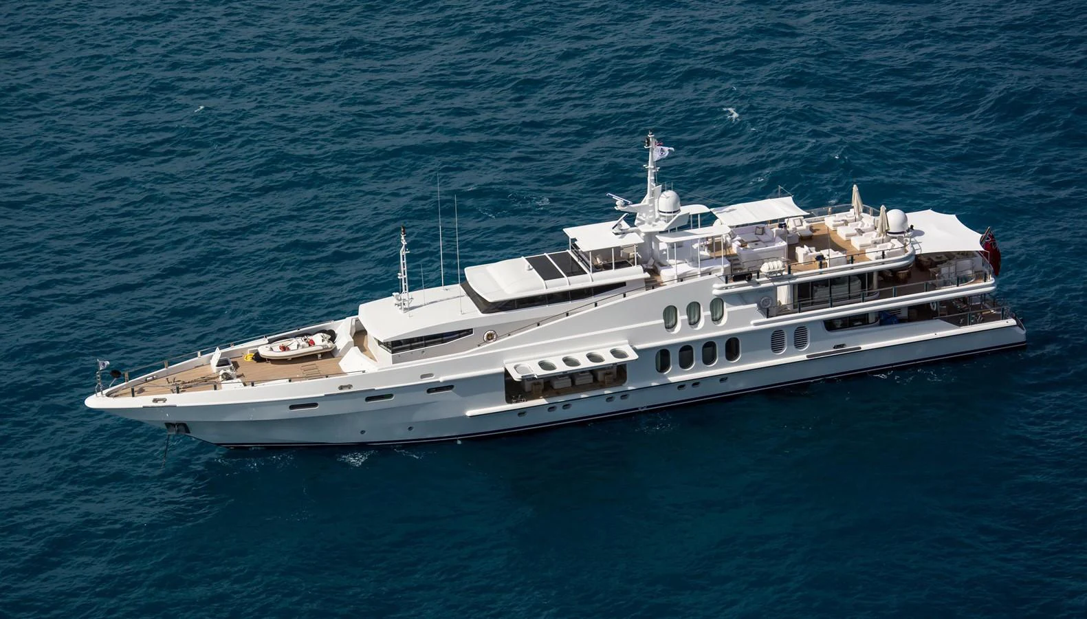 A sleek and luxurious yacht cruising on the open sea. aboard OCEANA I Yacht for Sale