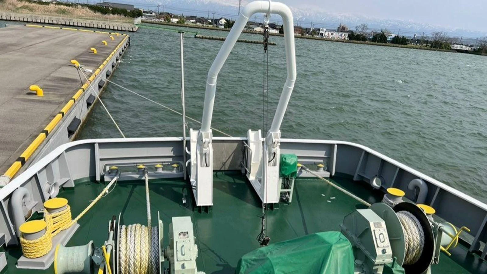 The image showcases the bow of a yacht with various equipment and mooring lines. aboard CUSTOM Yacht for Sale