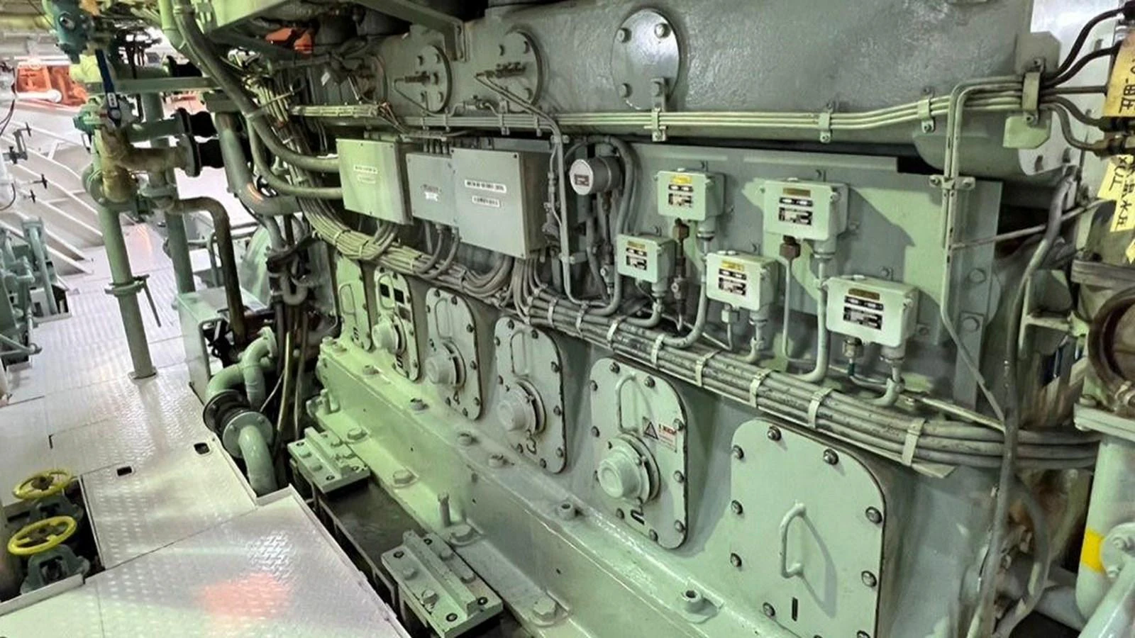 The image showcases the intricate machinery and components within the yacht's engine room. aboard CUSTOM Yacht for Sale