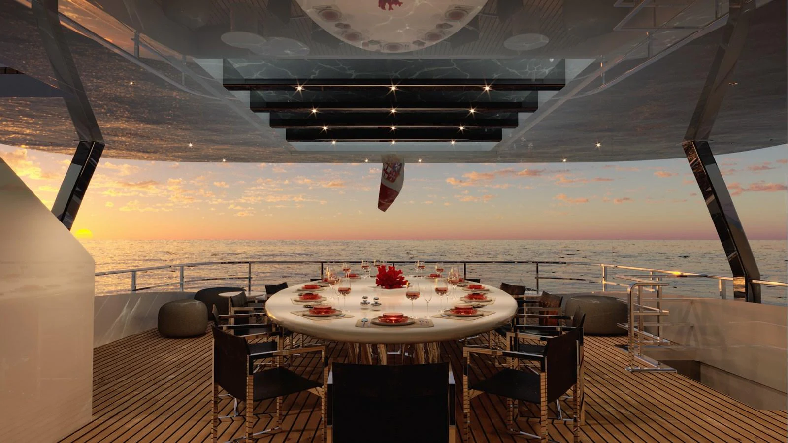 An elegant alfresco dining area on the yacht offers a stunning sunset view over the ocean. aboard NOON Yacht for Sale
