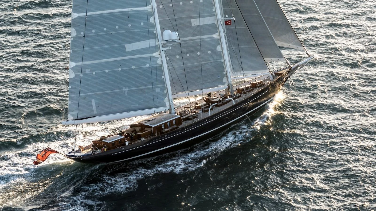 A stunning sailing yacht glides gracefully on the open water, showcasing its sleek design and impressive sails. aboard METEOR Yacht for Sale