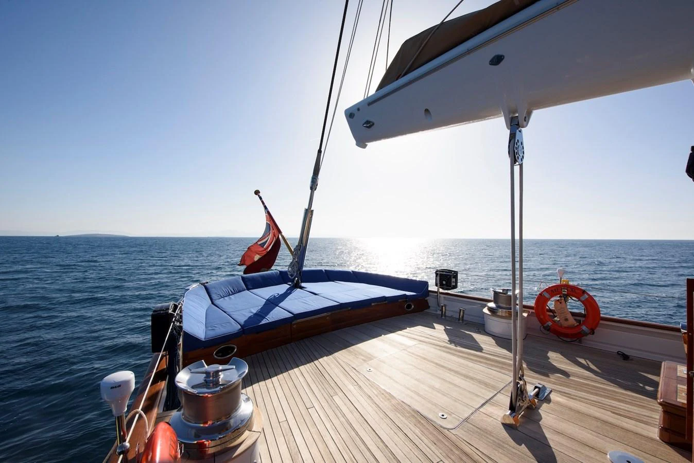 The aft deck offers a serene space with a sunpad and a view of the open sea. aboard METEOR Yacht for Sale