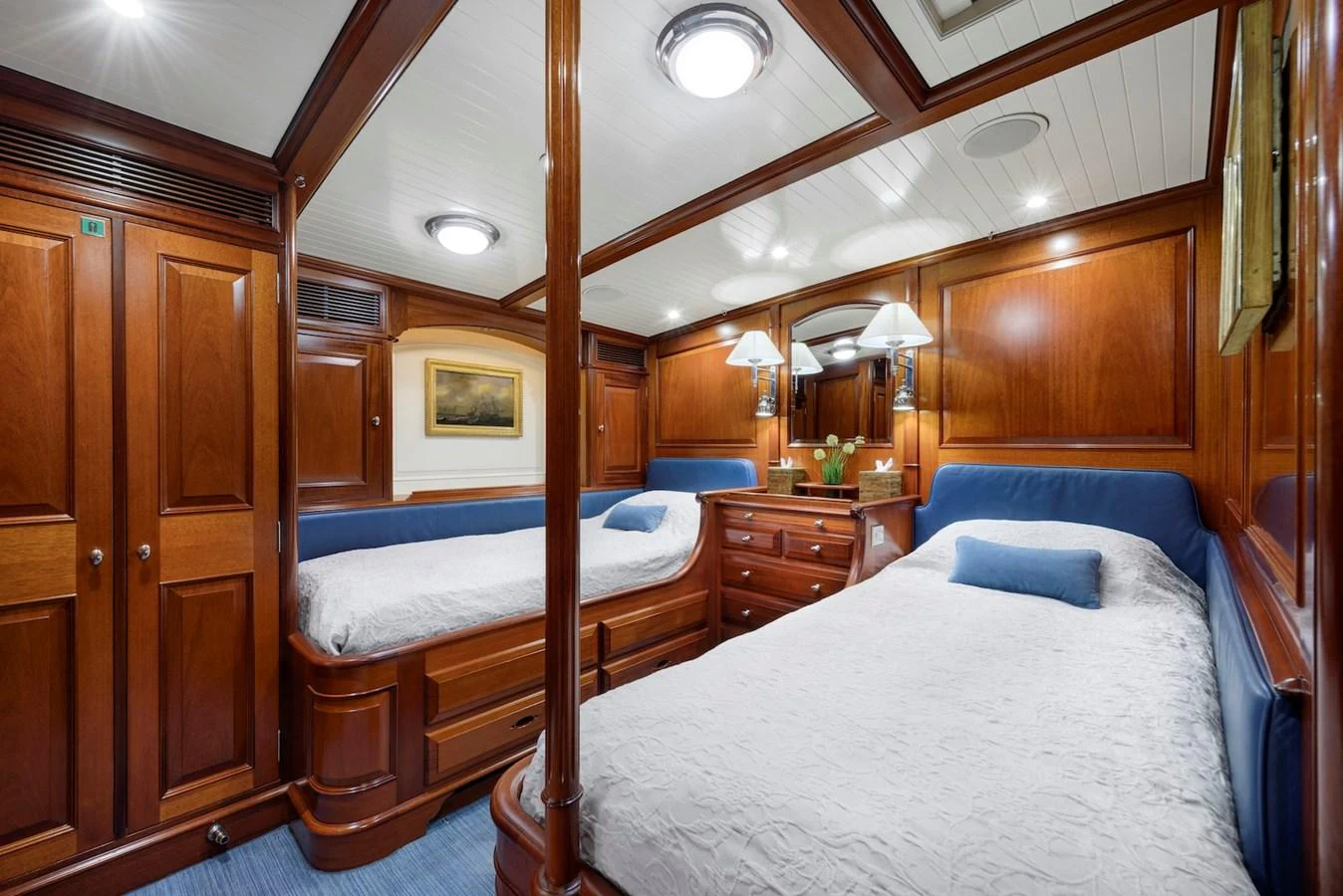 The guest stateroom features elegant wood paneling and twin beds for a comfortable stay. aboard METEOR Yacht for Sale