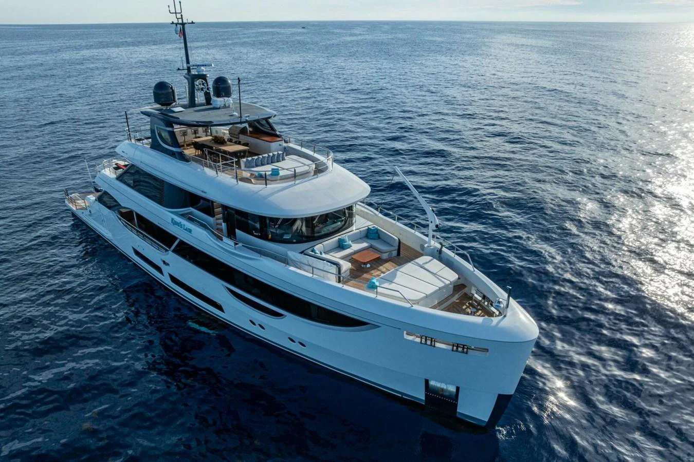 A luxurious yacht cruising on the open sea, showcasing its sleek design and spacious decks. aboard KING'S LAIR Yacht for Sale