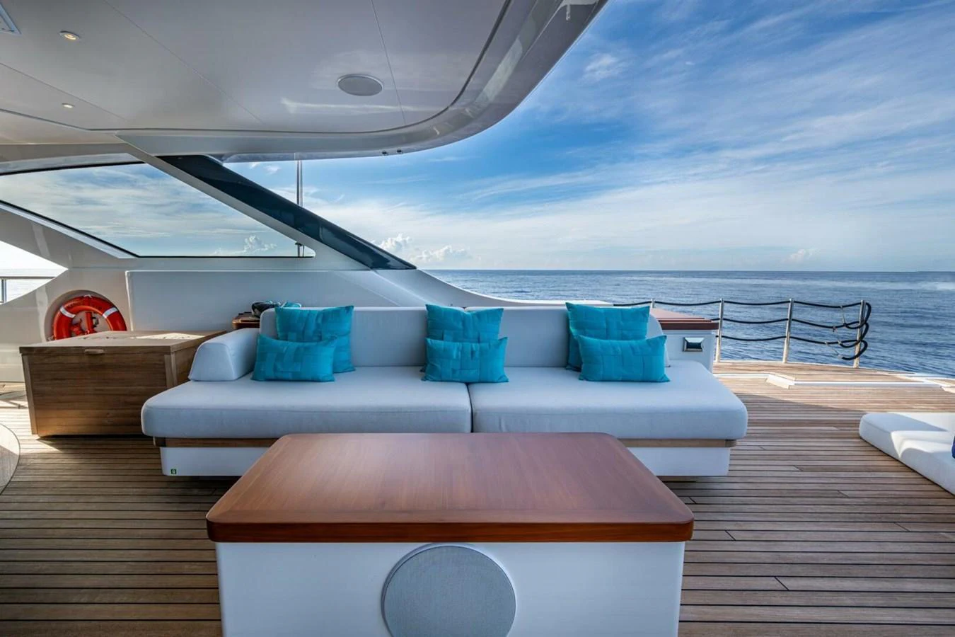 The aft deck offers a luxurious seating area with stunning ocean views. aboard KING'S LAIR Yacht for Sale