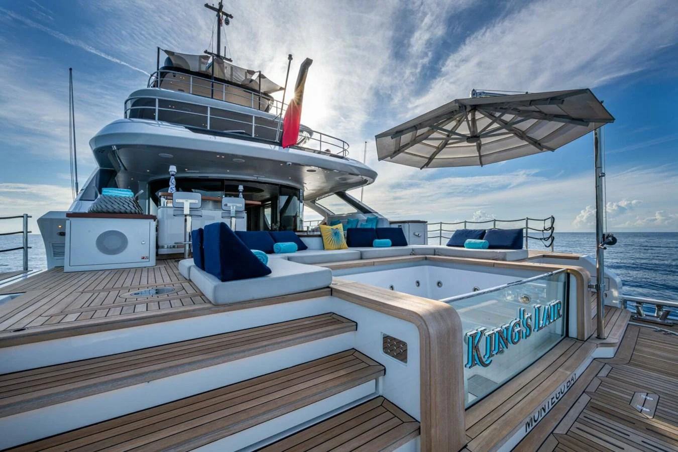 The aft deck features a luxurious jacuzzi and ample seating, perfect for relaxation and entertainment. aboard KING'S LAIR Yacht for Sale