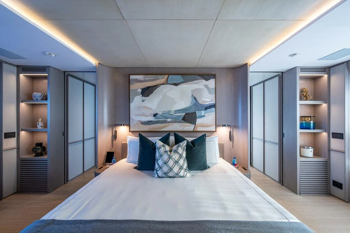 The master stateroom features a luxurious bed with elegant decor and ample storage space. aboard KING'S LAIR Yacht for Sale