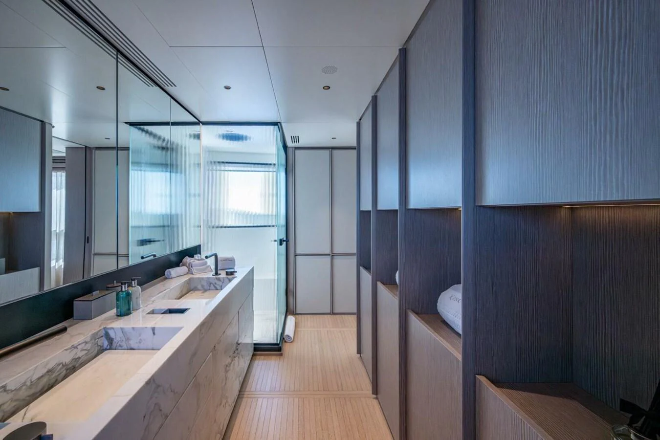 A luxurious yacht bathroom featuring modern fixtures and elegant design. aboard KING'S LAIR Yacht for Sale