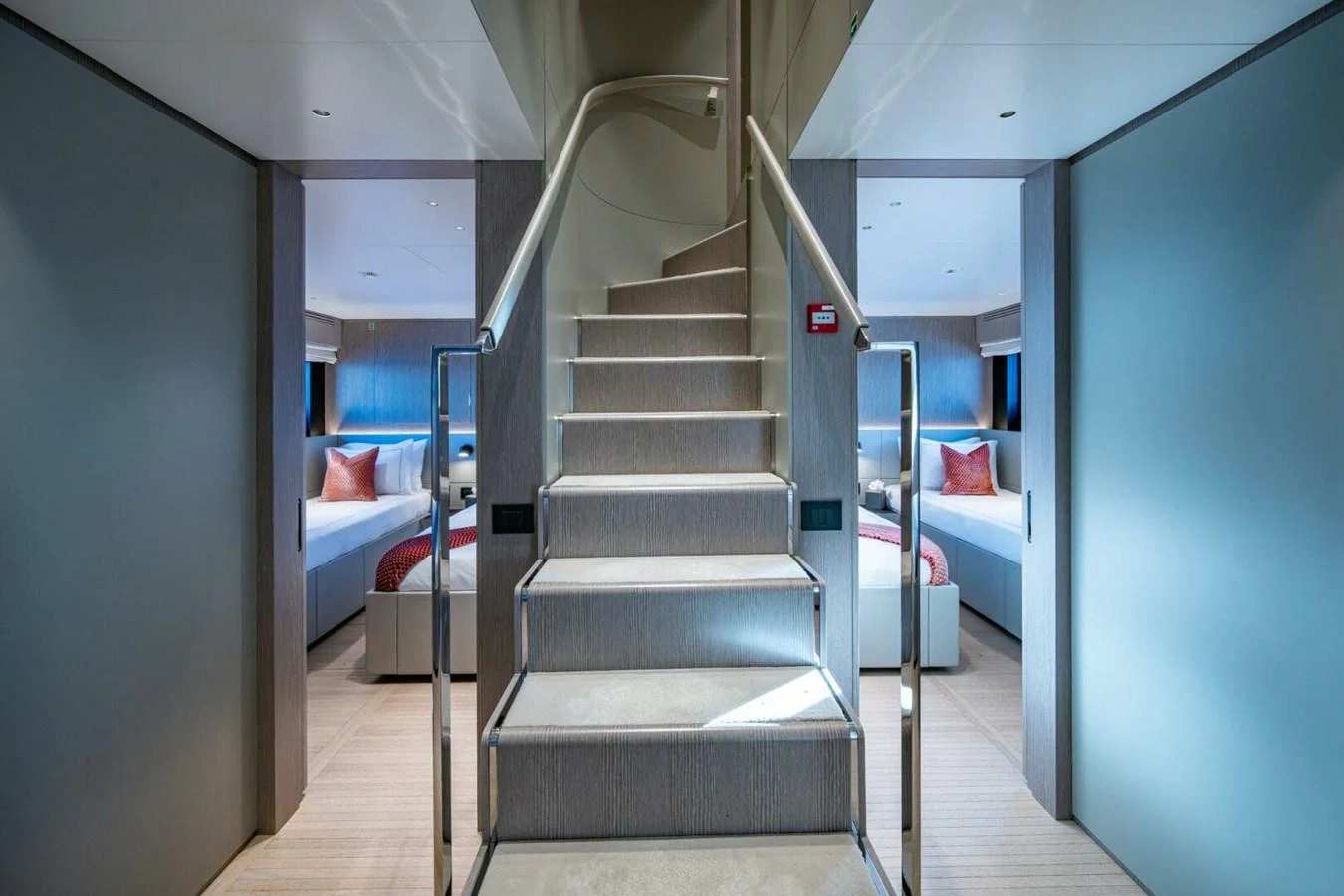 A modern and elegant staircase leads to twin staterooms, showcasing luxurious and contemporary design. aboard KING'S LAIR Yacht for Sale