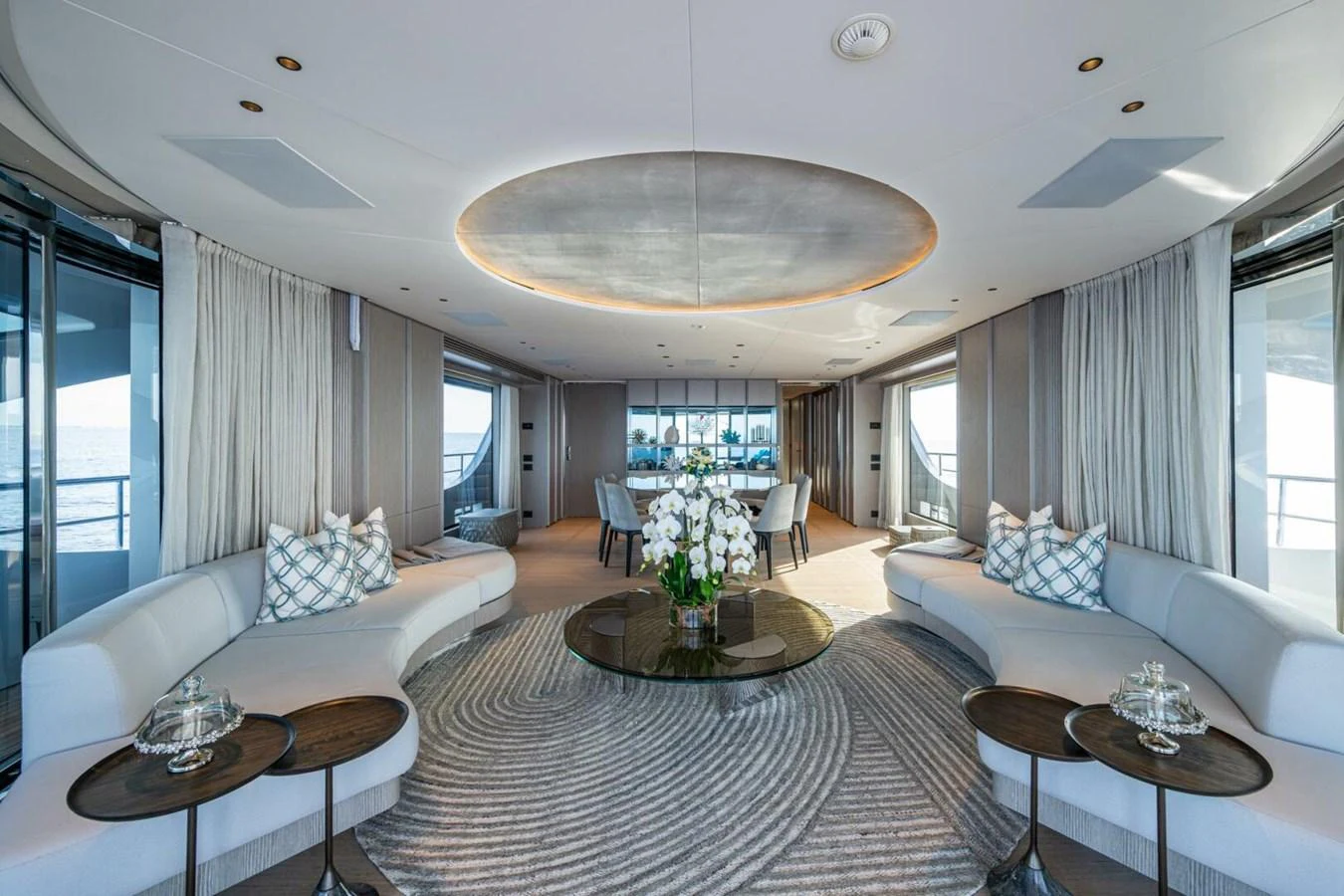 The spacious salon features elegant seating and a sophisticated decor, perfect for relaxation and socializing. aboard KING'S LAIR Yacht for Sale