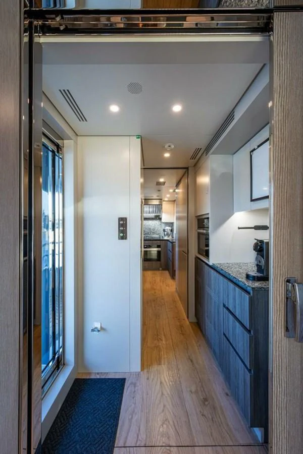 The sleek and modern galley features high-end appliances and stylish cabinetry. aboard KING'S LAIR Yacht for Sale