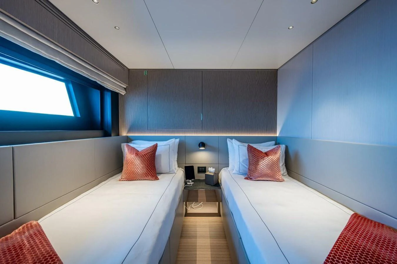 The twin stateroom features two single beds with elegant bedding and modern decor. aboard KING'S LAIR Yacht for Sale