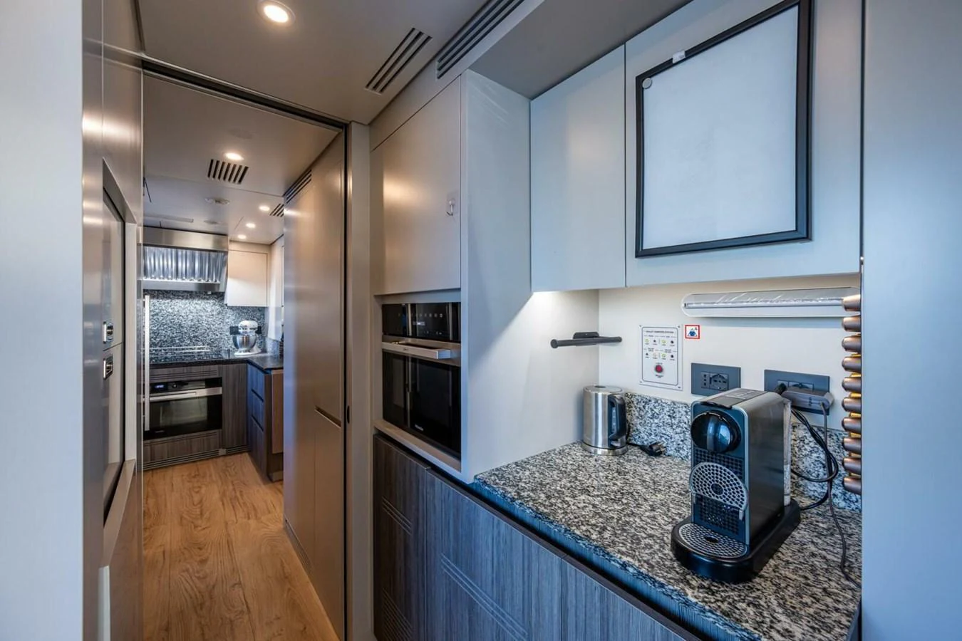 The yacht's galley features modern appliances and sleek countertops, providing a stylish and functional space for meal preparation. aboard KING'S LAIR Yacht for Sale
