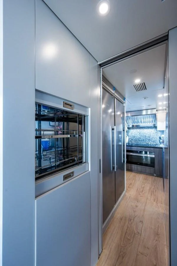 The sleek and modern galley features stainless steel appliances and ample storage space. aboard KING'S LAIR Yacht for Sale