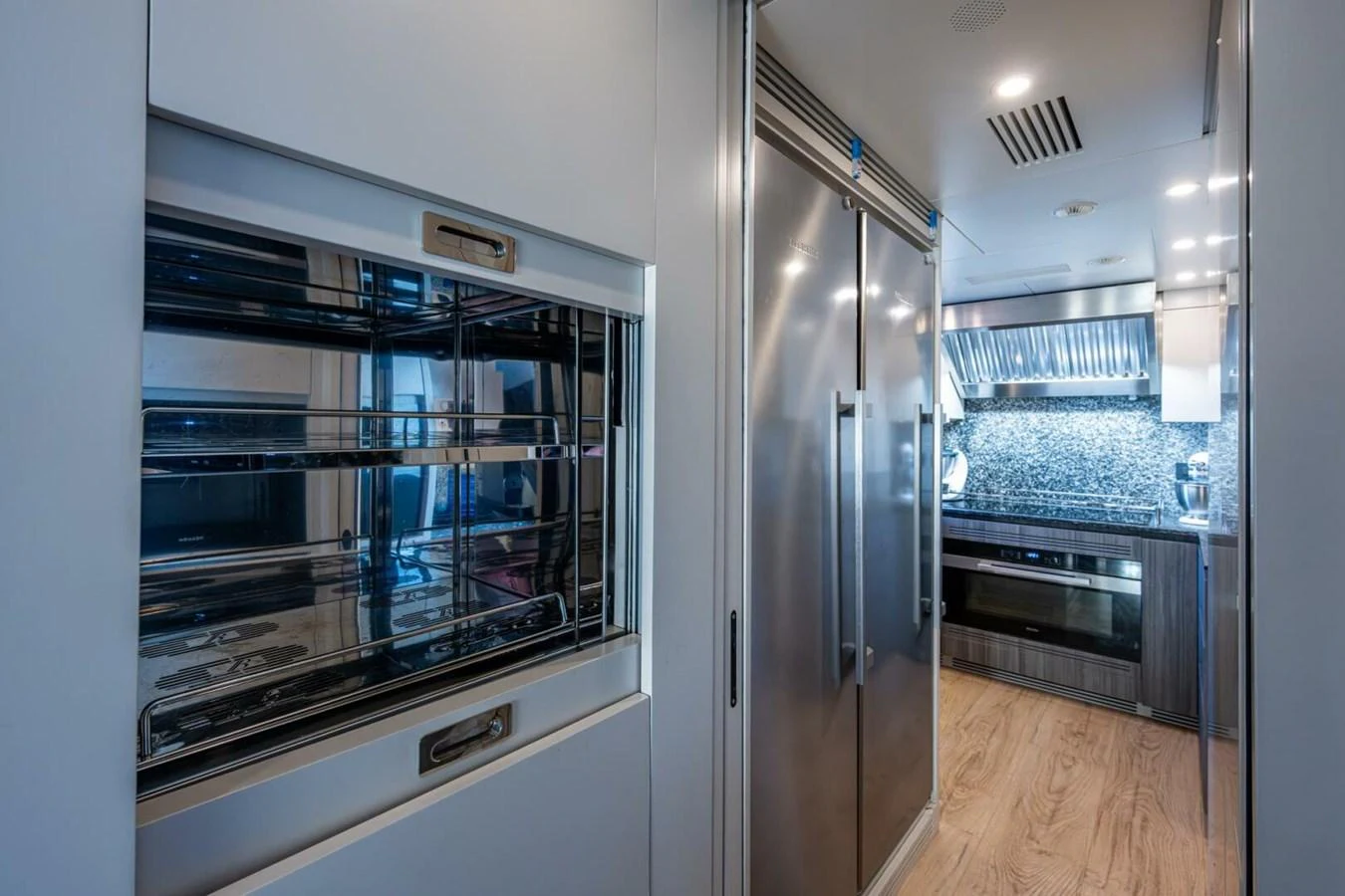 The yacht's galley features modern appliances and sleek design for gourmet cooking. aboard KING'S LAIR Yacht for Sale