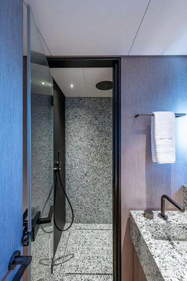 A modern yacht bathroom with a sleek design and high-end fixtures. aboard KING'S LAIR Yacht for Sale