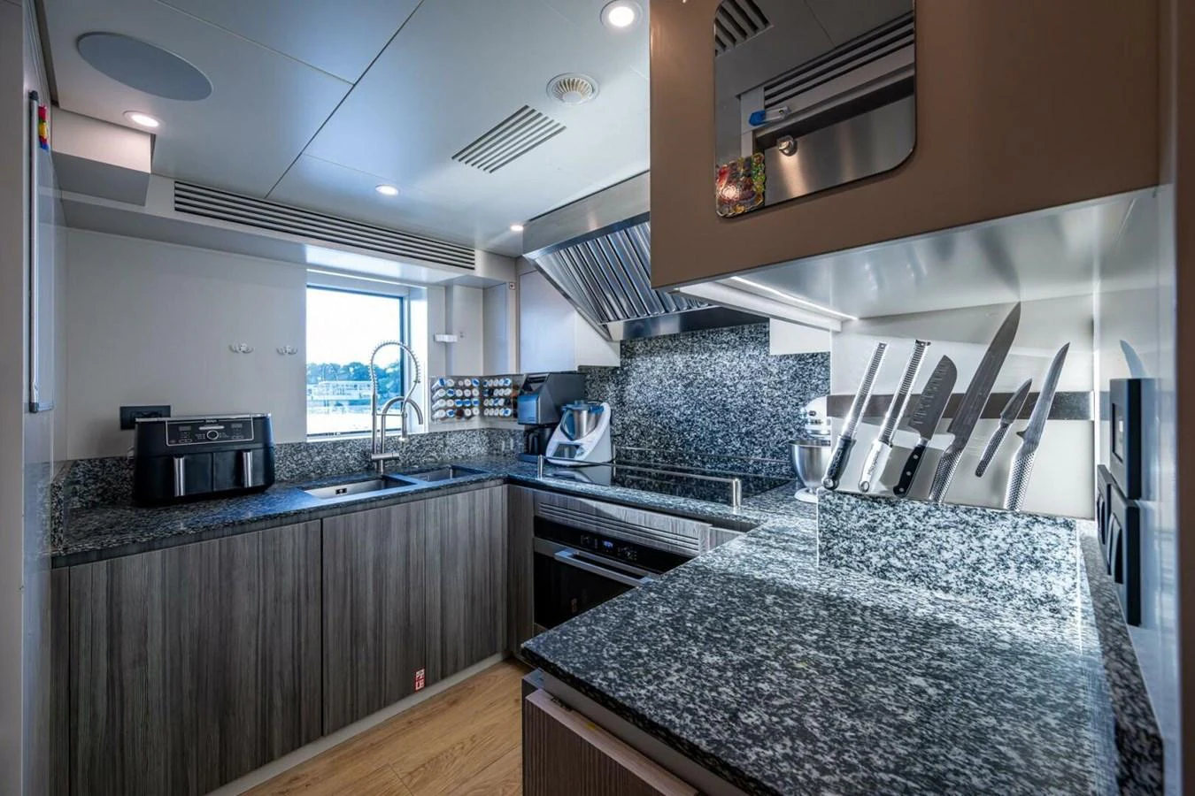 The yacht's galley is equipped with modern appliances and ample counter space for meal preparation. aboard KING'S LAIR Yacht for Sale