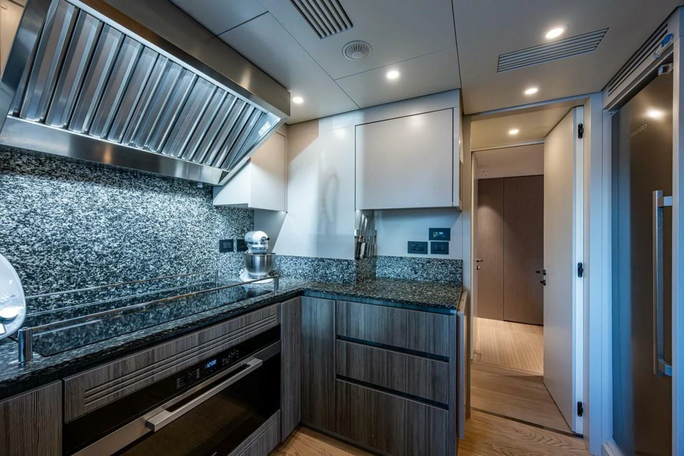 The yacht's galley features modern appliances and sleek finishes, perfect for gourmet cooking at sea. aboard KING'S LAIR Yacht for Sale