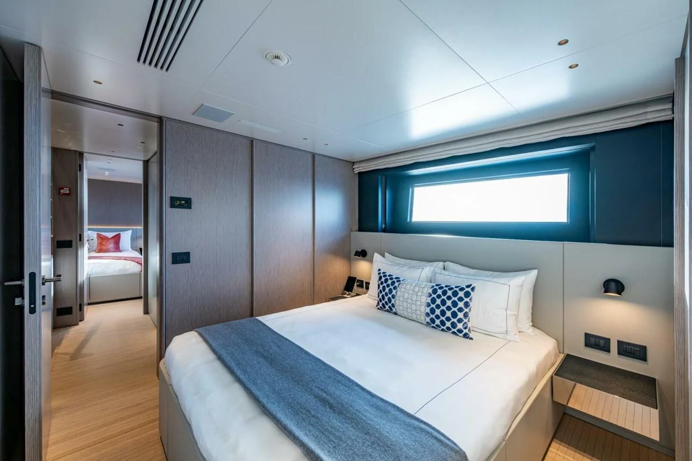 A luxurious stateroom featuring a comfortable bed and modern decor. aboard KING'S LAIR Yacht for Sale