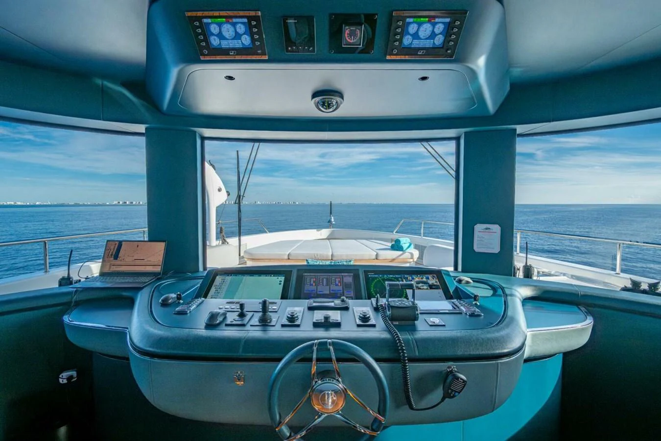 The helm station offers a commanding view of the open sea with state-of-the-art navigation equipment. aboard KING'S LAIR Yacht for Sale