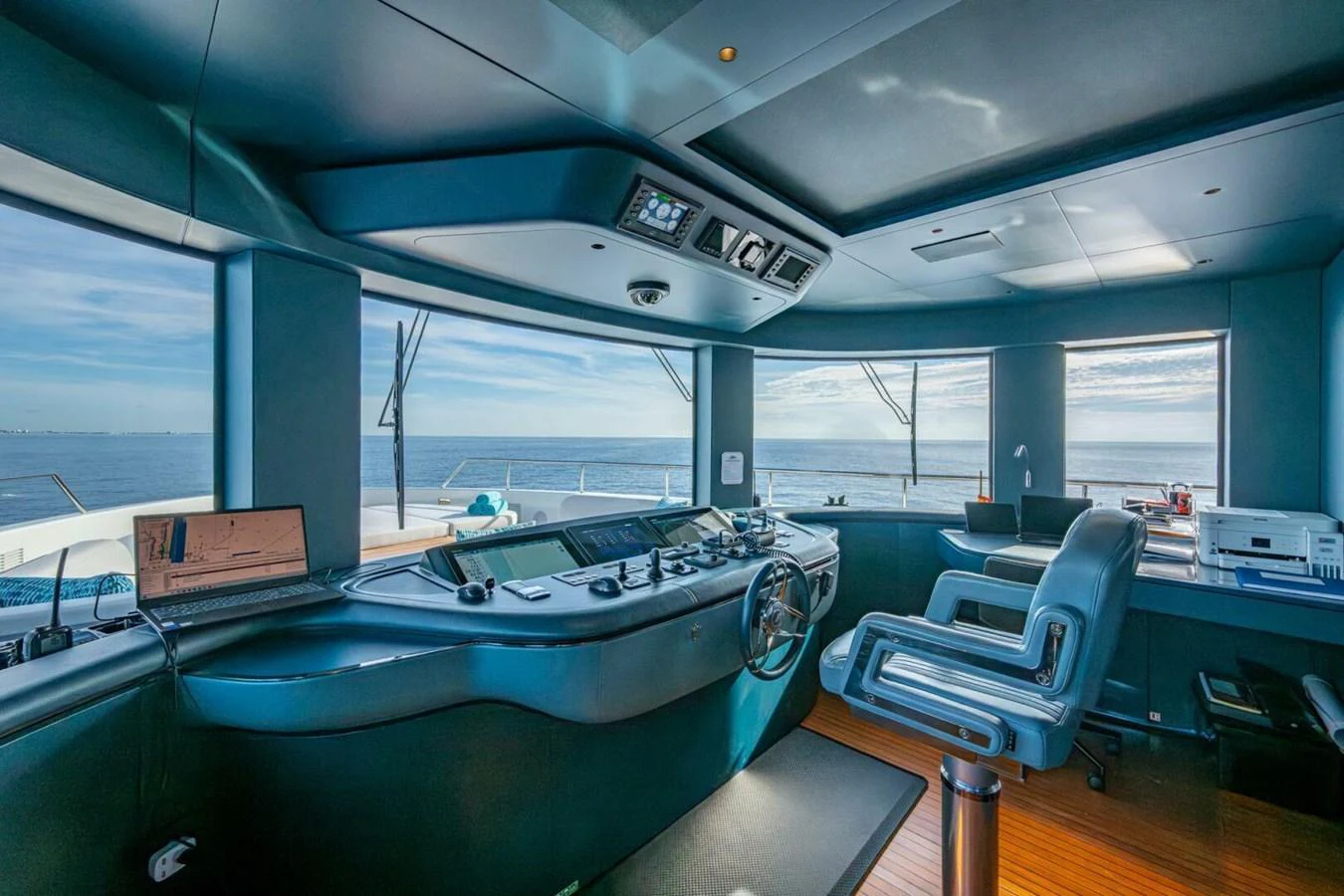 The helm station offers a panoramic view with state-of-the-art navigation equipment and luxurious seating. aboard KING'S LAIR Yacht for Sale