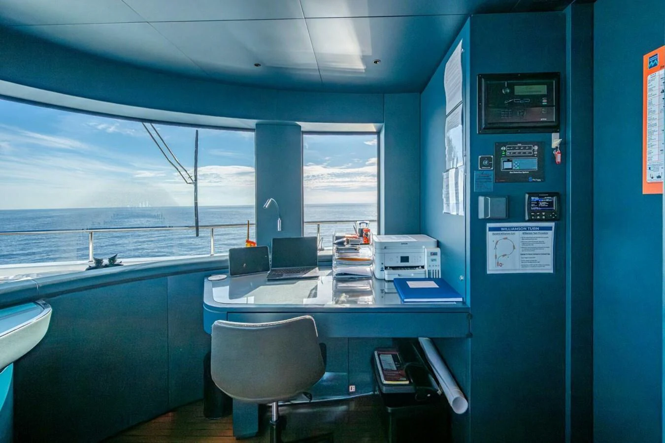 The helm station offers a panoramic view of the sea with modern navigation equipment. aboard KING'S LAIR Yacht for Sale