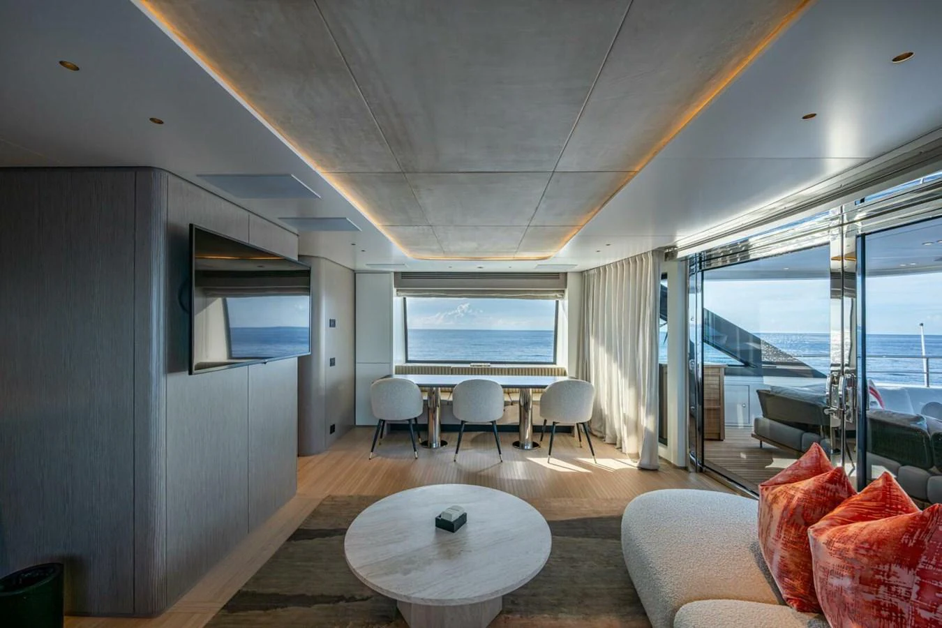 The salon offers a spacious and modern living area with panoramic ocean views. aboard KING'S LAIR Yacht for Sale