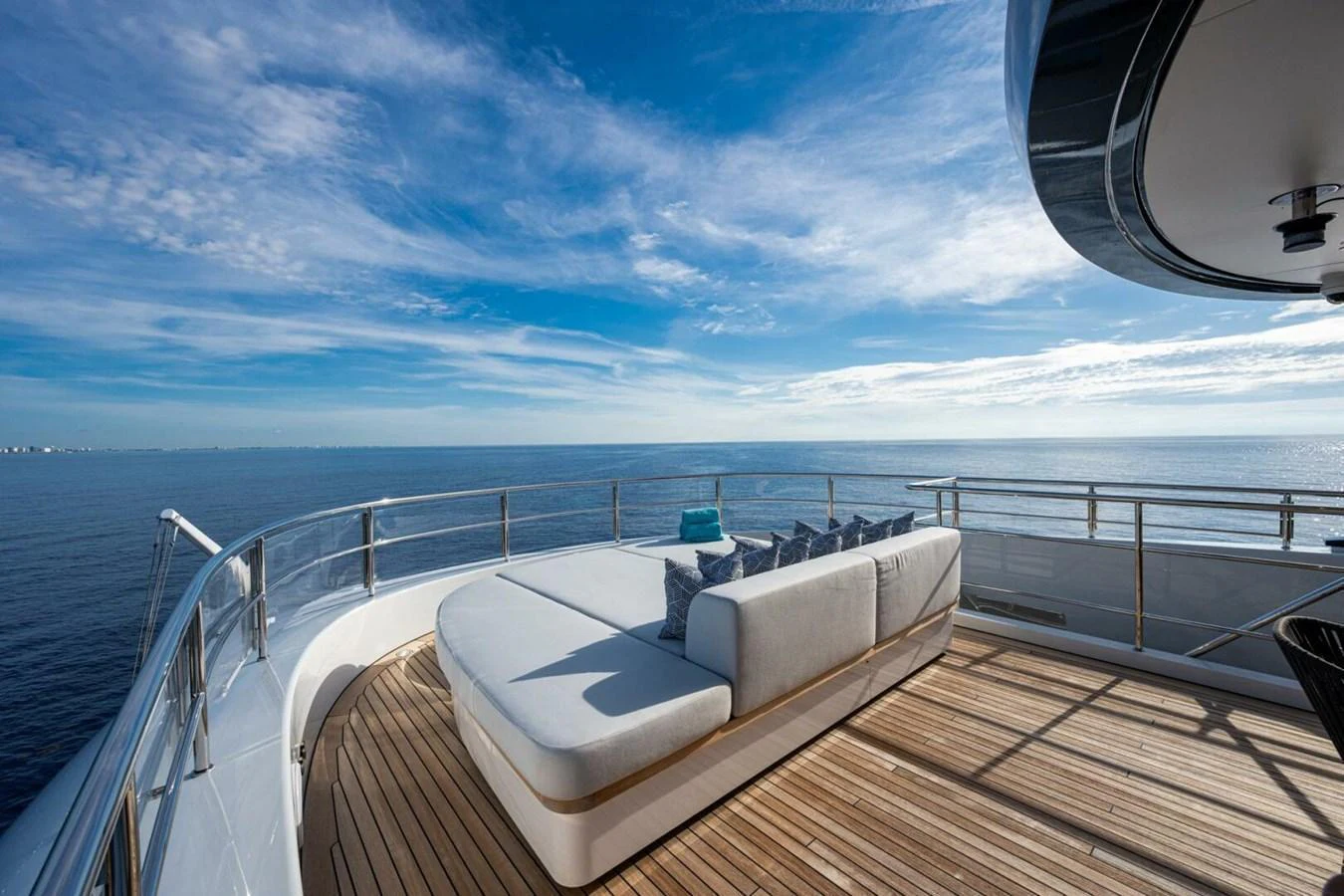 The sundeck offers a luxurious lounging area with panoramic ocean views. aboard KING'S LAIR Yacht for Sale