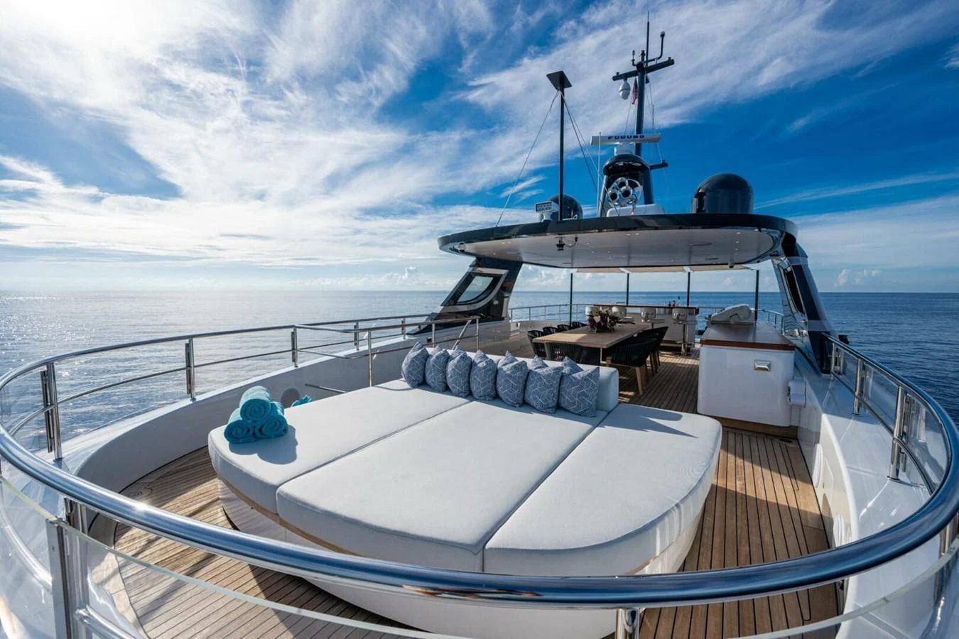 The sundeck offers a luxurious lounging area with panoramic ocean views. aboard KING'S LAIR Yacht for Sale