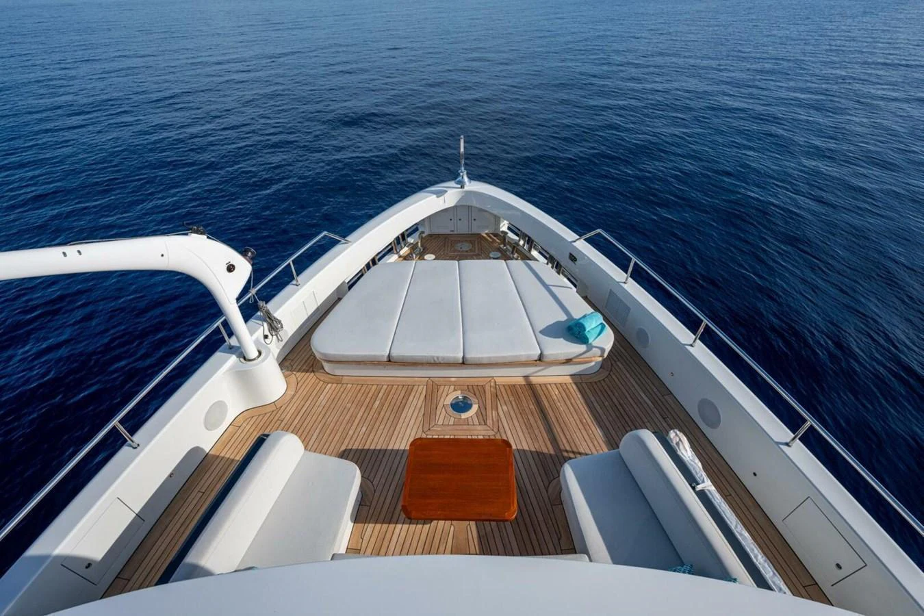 The foredeck features spacious sun pads and a seating area, perfect for relaxation while cruising. aboard KING'S LAIR Yacht for Sale