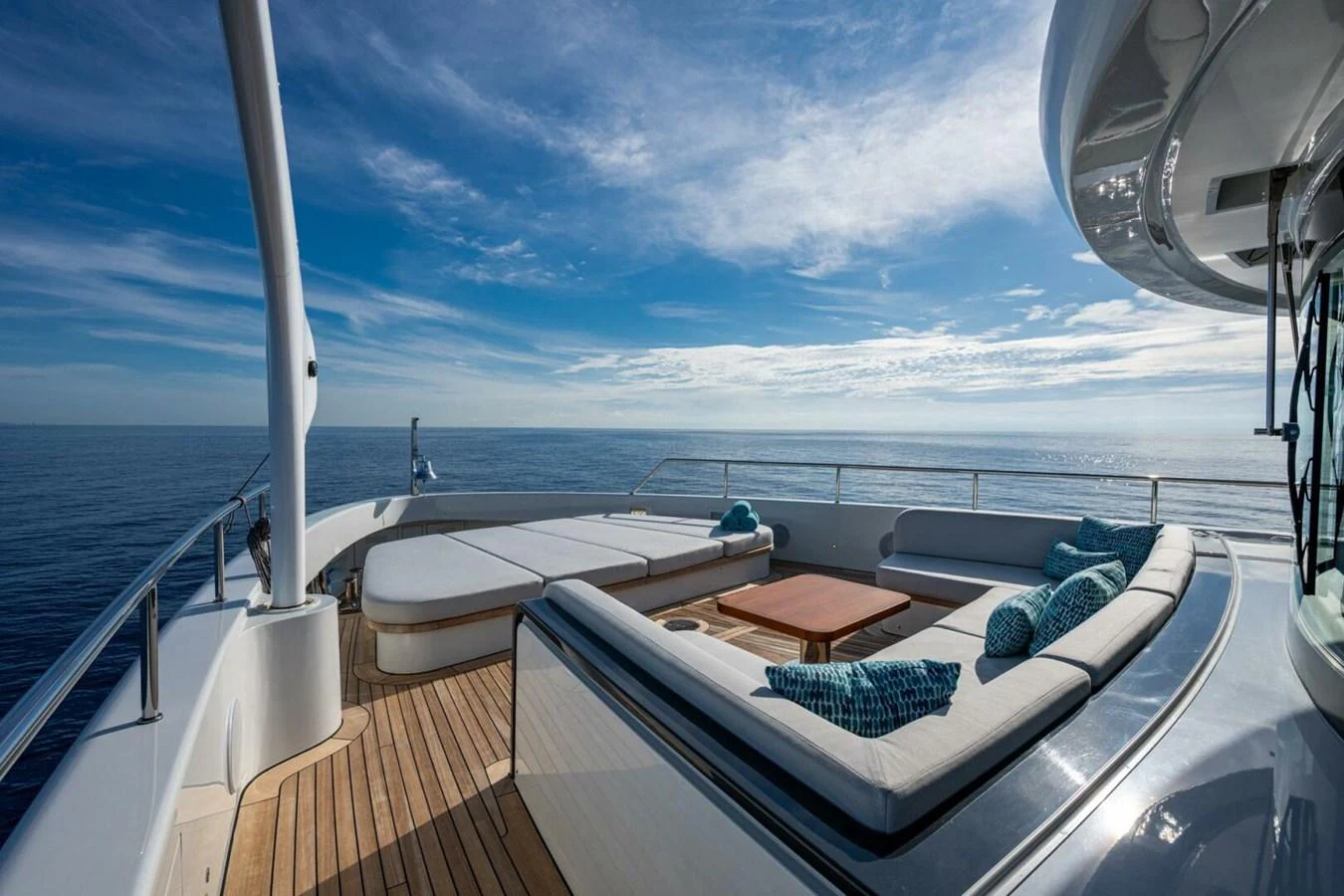 The aft deck offers a spacious and luxurious seating area with stunning ocean views. aboard KING'S LAIR Yacht for Sale