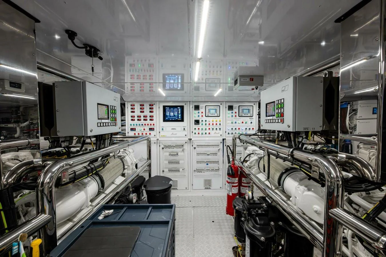 The yacht's engine room showcases advanced machinery and control systems in a pristine environment. aboard KING'S LAIR Yacht for Sale