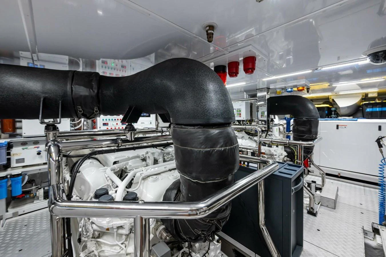 The engine room showcases advanced machinery and a pristine, well-organized layout. aboard KING'S LAIR Yacht for Sale