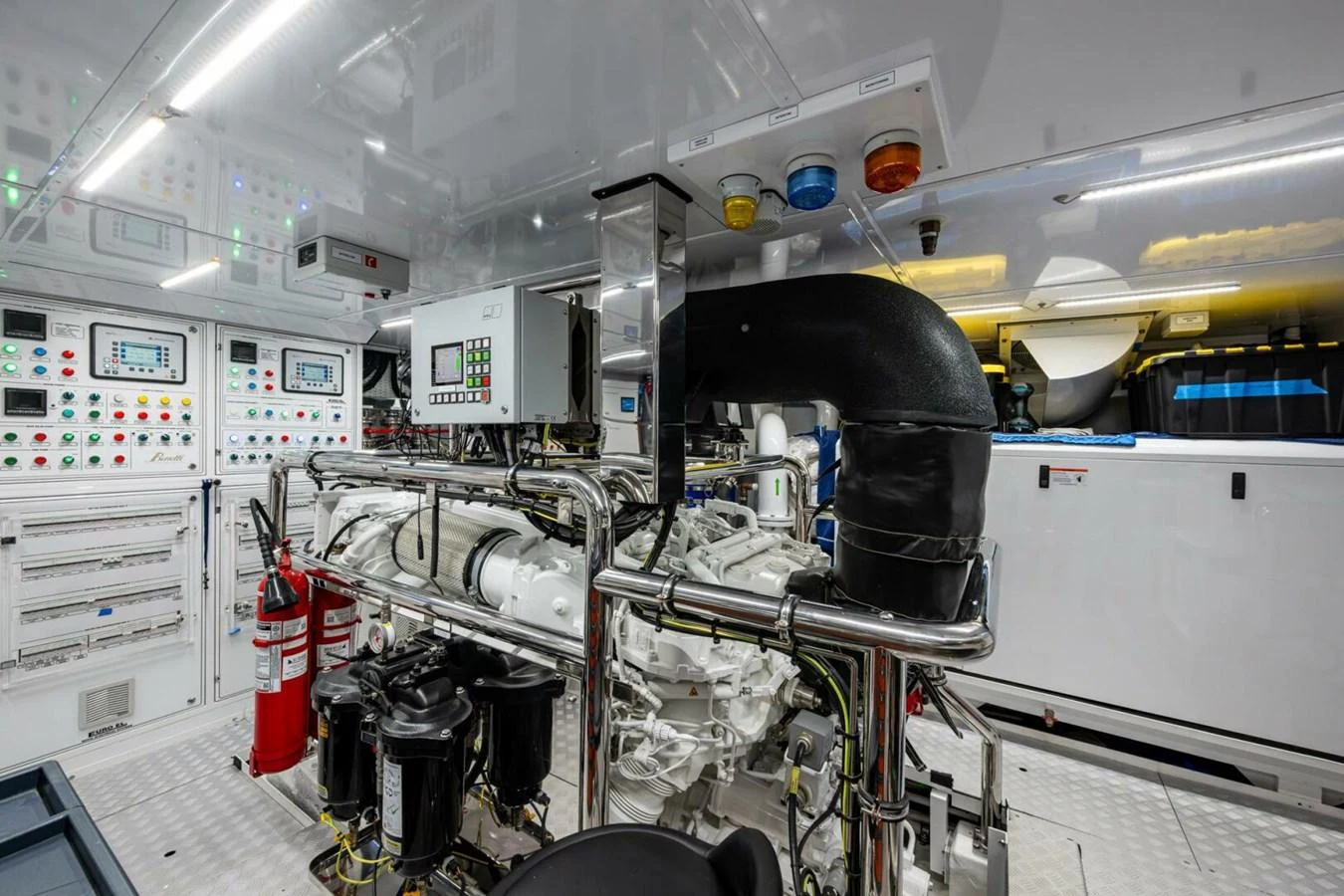The yacht's engine room showcases advanced machinery and control systems, ensuring optimal performance and safety. aboard KING'S LAIR Yacht for Sale