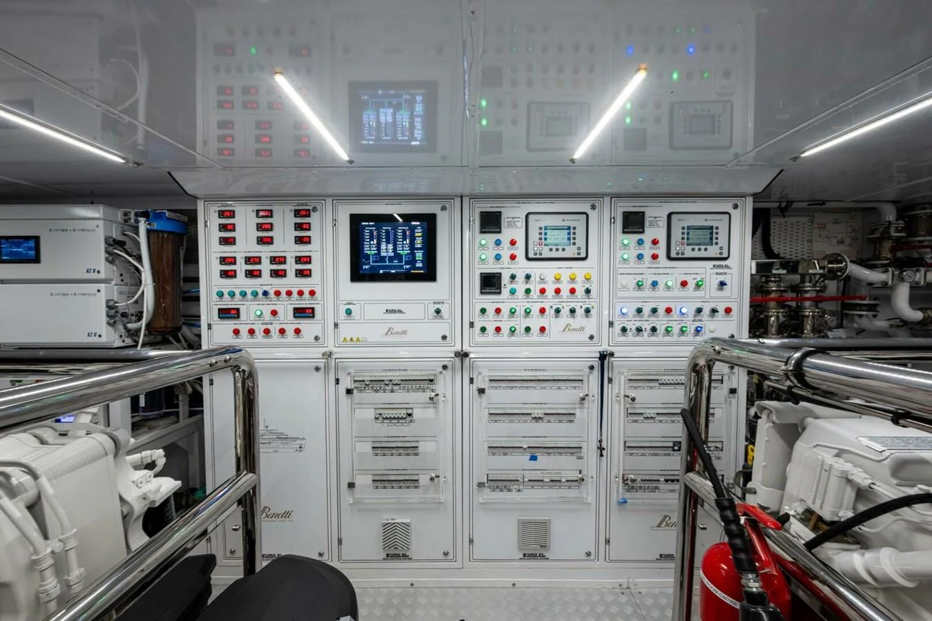 The yacht's engine room features advanced control panels and equipment, showcasing its technical sophistication. aboard KING'S LAIR Yacht for Sale