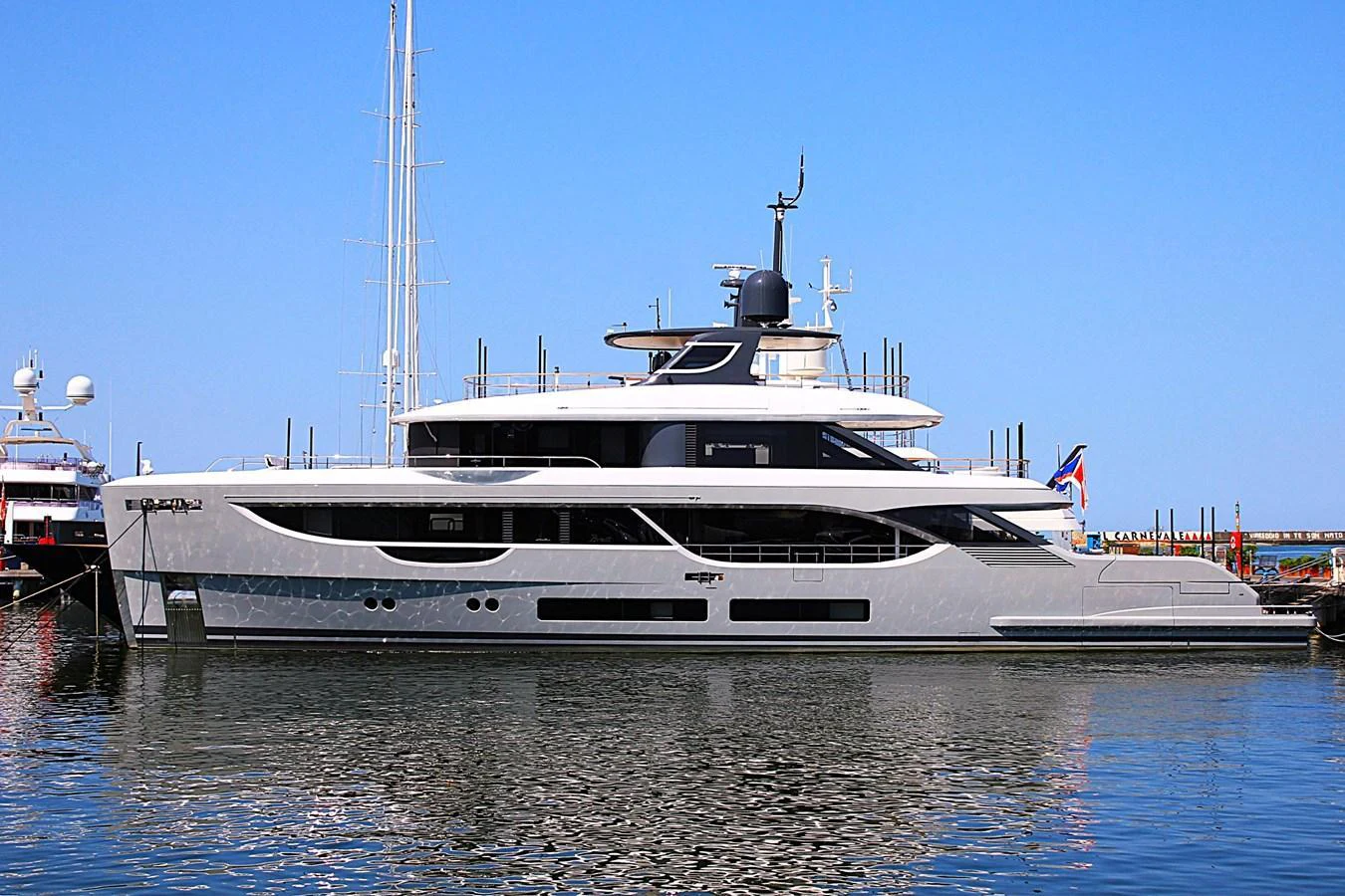 A sleek and modern yacht is docked at the marina, showcasing its elegant design and luxurious amenities. aboard OASIS 34M BO212 Yacht for Sale