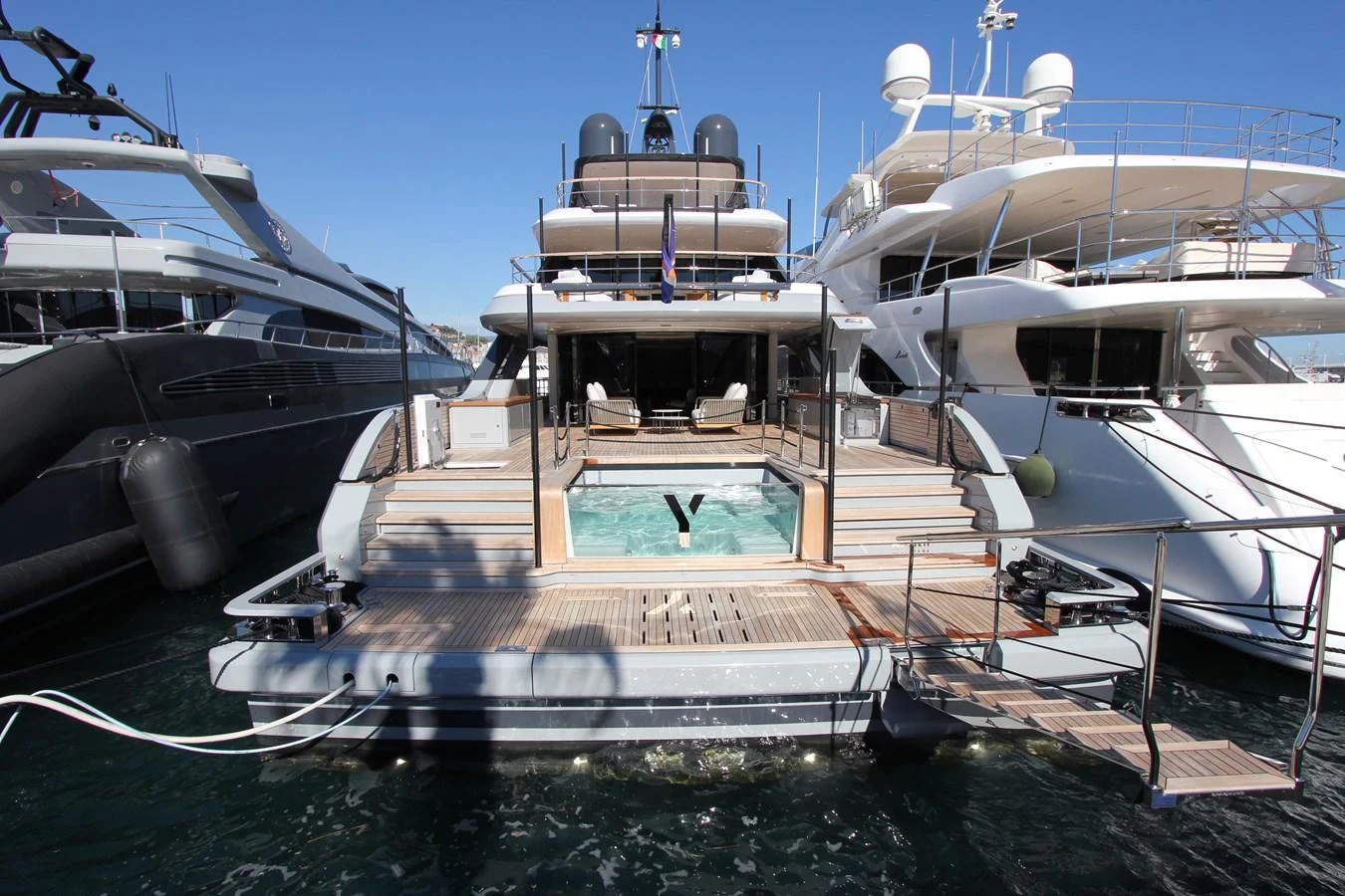 The yacht's aft deck features a luxurious pool area, perfect for relaxation and entertainment. aboard OASIS 34M BO212 Yacht for Sale