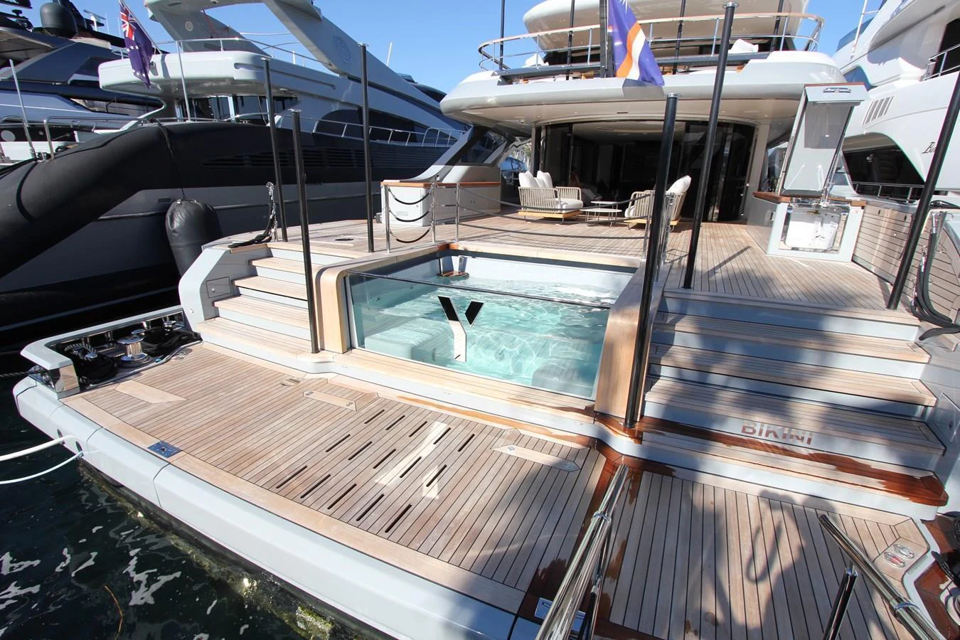 The aft deck features a luxurious pool with surrounding lounging areas, perfect for relaxation and entertainment. aboard OASIS 34M BO212 Yacht for Sale