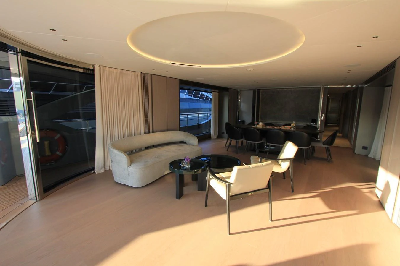 The yacht's interior features a spacious and elegantly designed lounge area with modern furnishings and ample natural light. aboard OASIS 34M BO212 Yacht for Sale