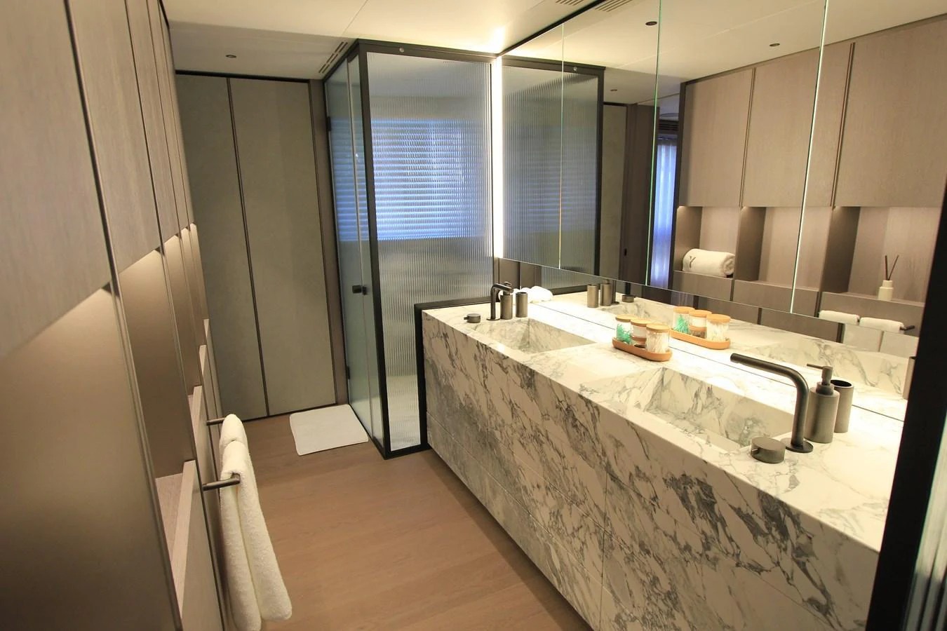 The yacht's bathroom features a luxurious marble countertop and modern fixtures. aboard OASIS 34M BO212 Yacht for Sale