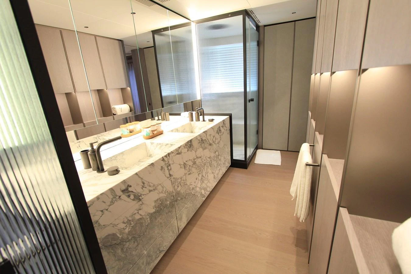 The yacht's bathroom features a luxurious marble countertop and modern fixtures. aboard OASIS 34M BO212 Yacht for Sale