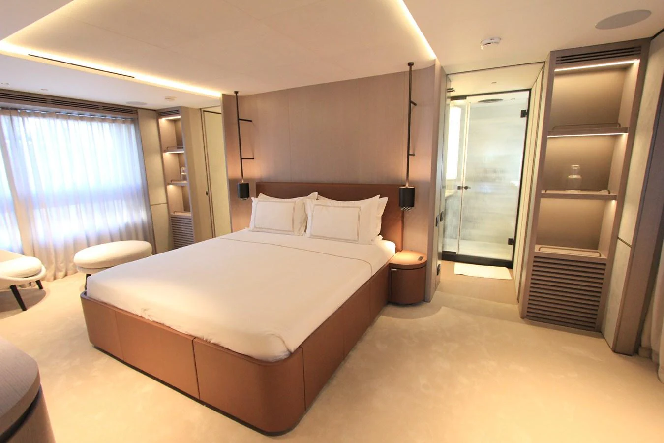 The master stateroom features a luxurious bed with elegant lighting and ample storage. aboard OASIS 34M BO212 Yacht for Sale